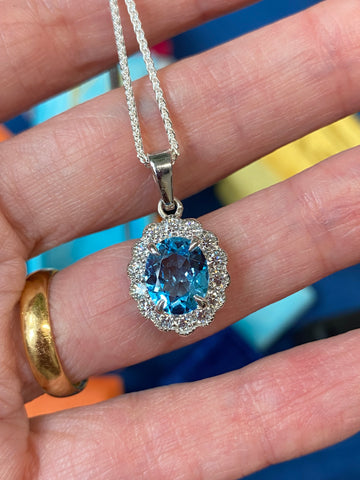 5.00 CTW Blue Topaz and Moissanite Halo Pendant Necklace in Sterling Silver