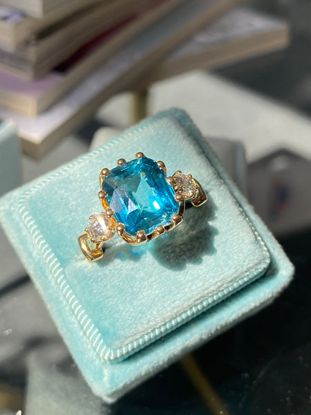 6.75 Carat Blue Zircon and Diamond Three Stone Ring in 18ct Yellow Gold
