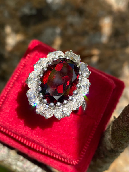 8.17 CTW Oval Cut Garnet and Moissanite Halo Cocktail Ring