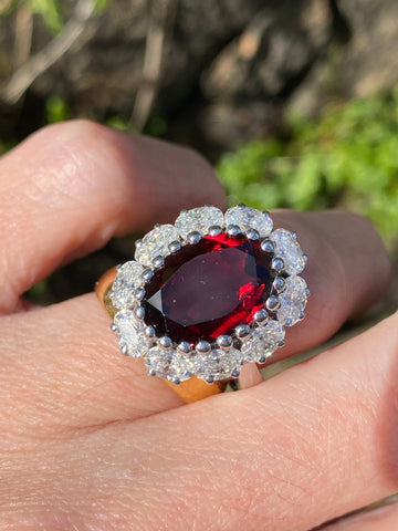 8.17 CTW Oval Cut Garnet and Moissanite Halo Cocktail Ring