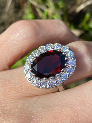 8.25 CTW Oval Cut Garnet and Moissanite Halo Cocktail Ring