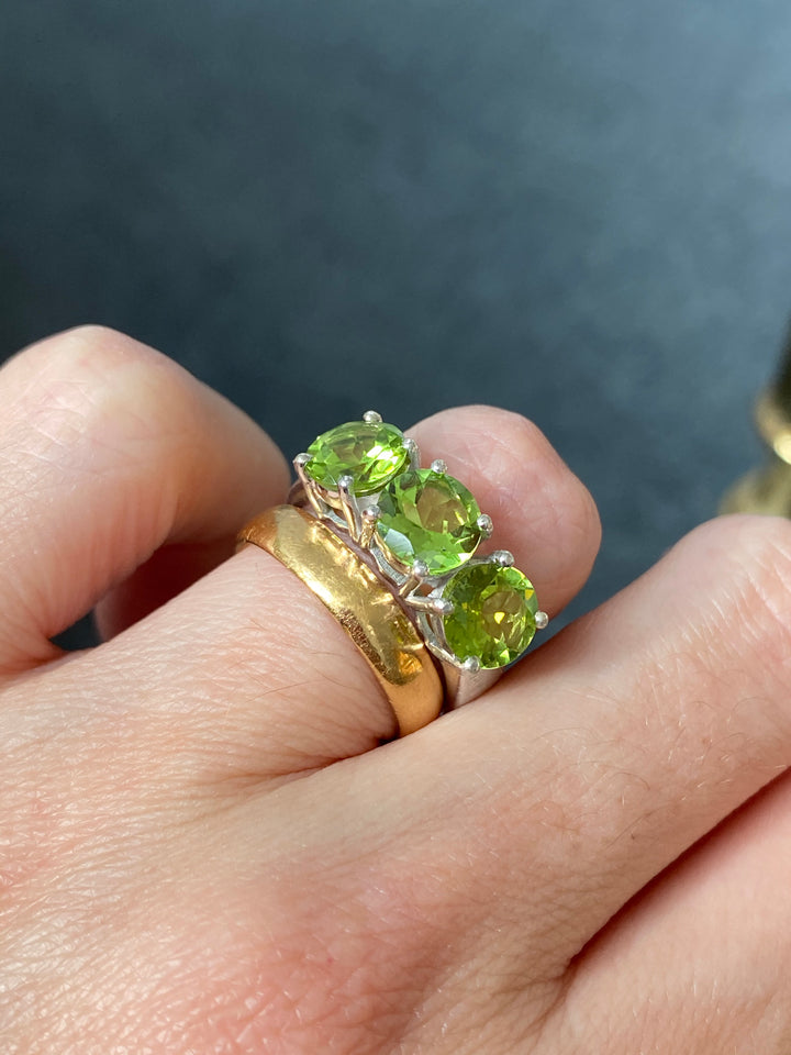 Round Cut Peridot Three Stone Ring in Sterling Silver