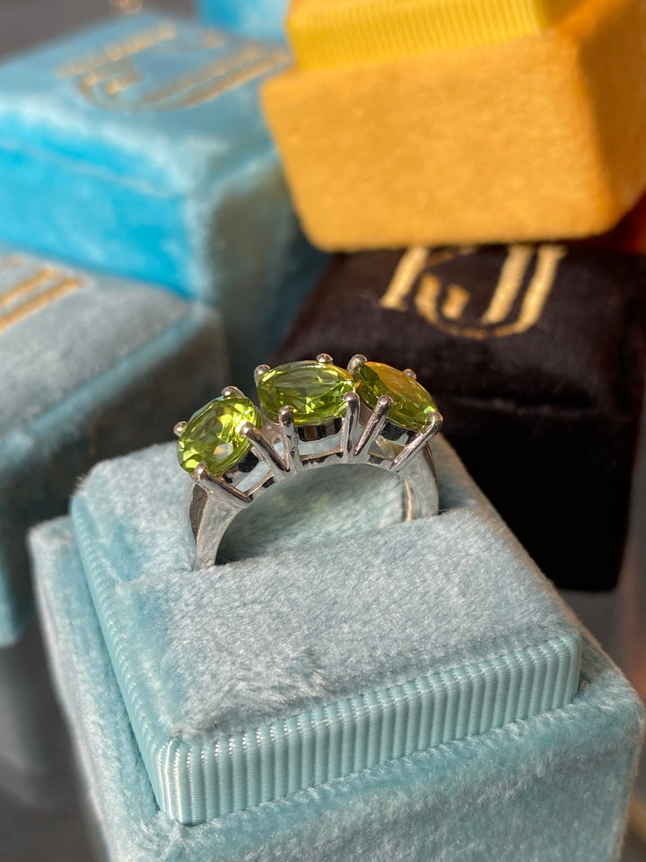 Round Cut Peridot Three Stone Ring in Sterling Silver