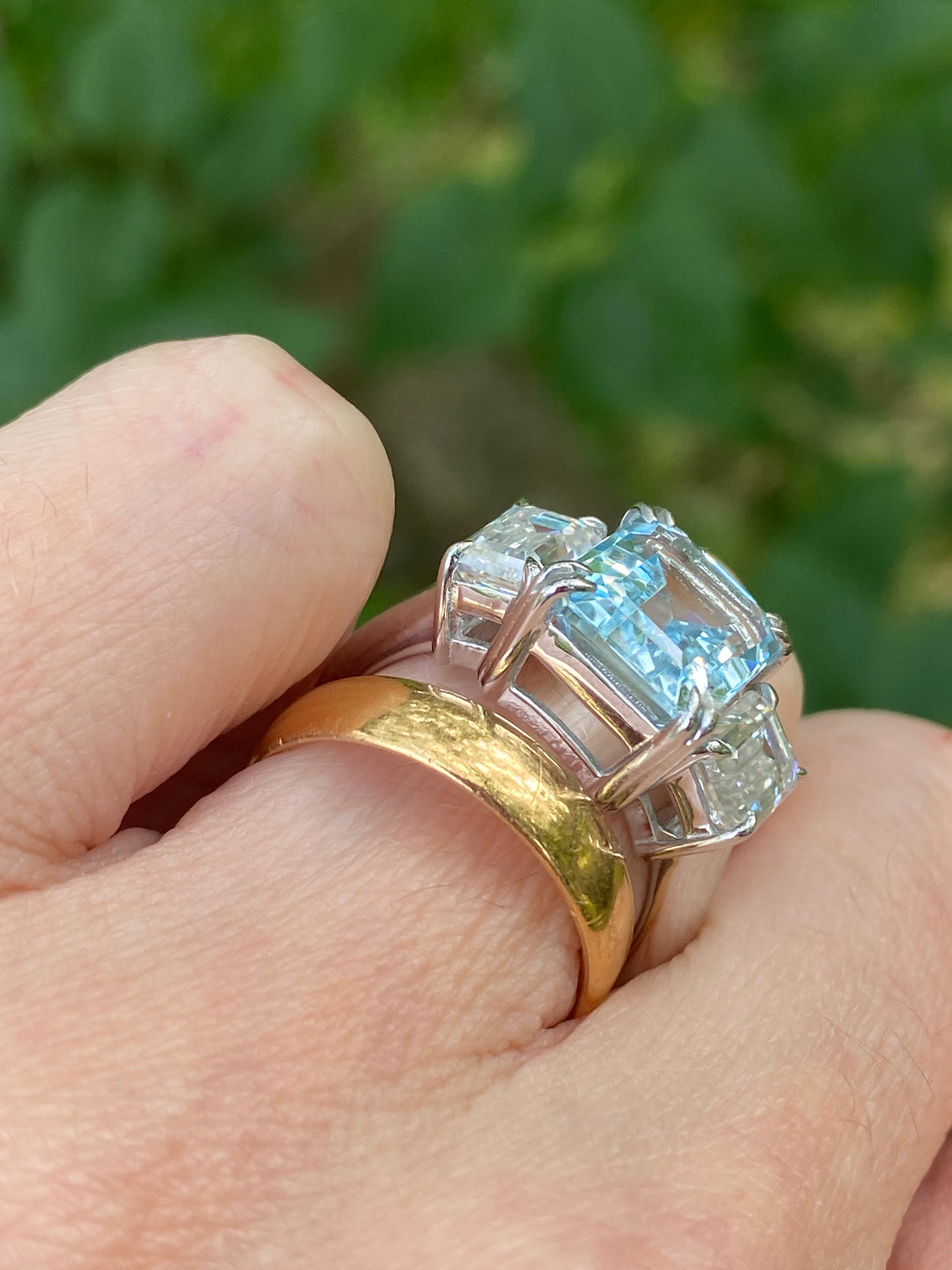 5.71 Carat Emerald Cut Blue Topaz and 2.00 Carat Moissanite Three Stone Ring in Sterling Silver