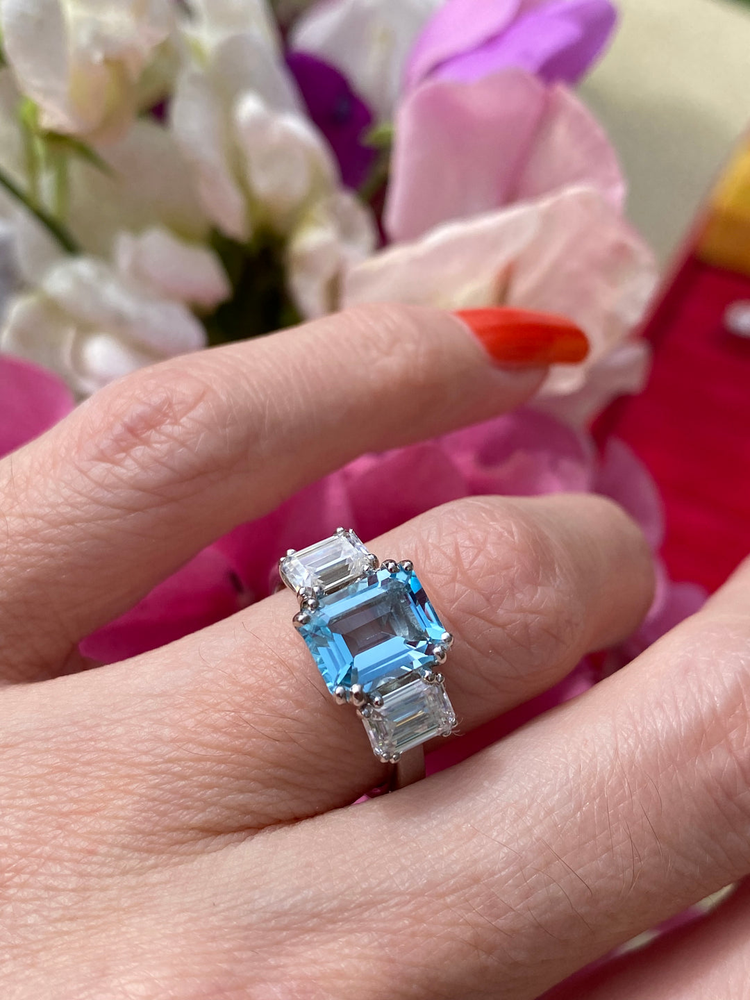 3.50 CTW Emerald Cut Blue Topaz and Moissanite Three Stone Ring in Sterling Silver