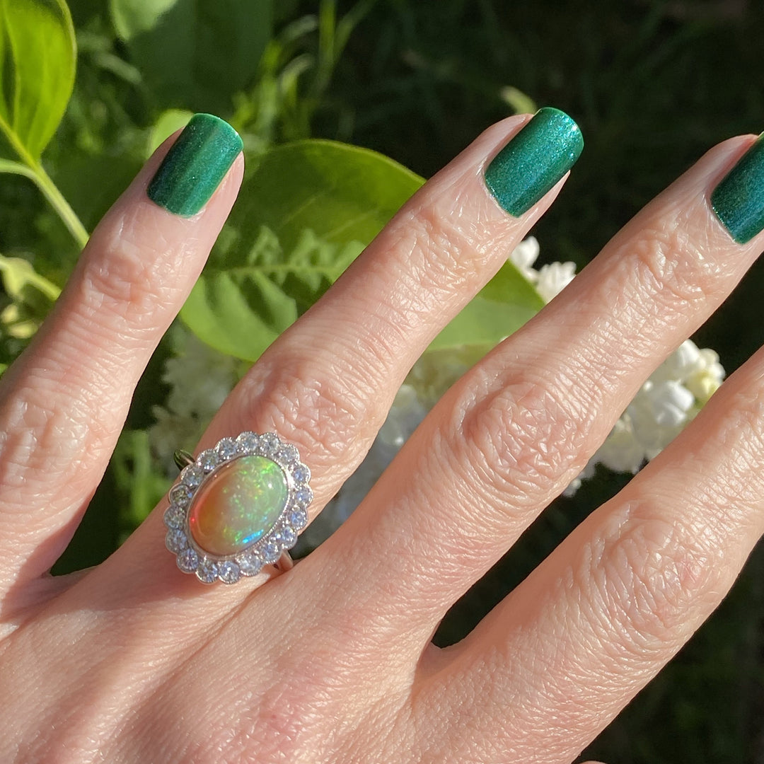 Oval Opal and Diamond Halo Engagement Ring 