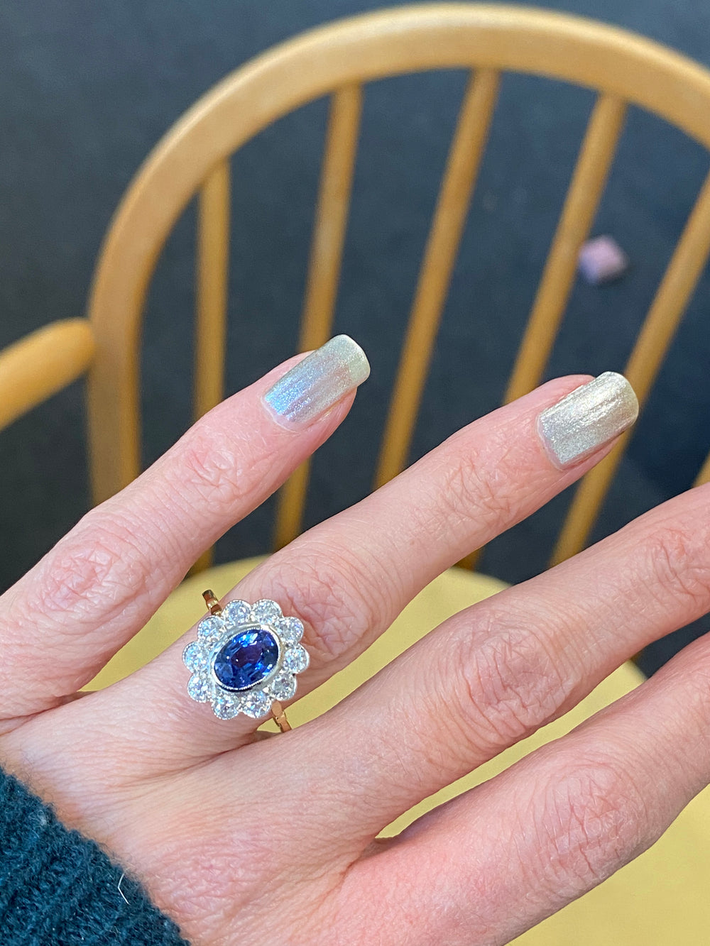 Oval Cut Blue Sapphire and Diamond Halo Engagement Ring in Gold 