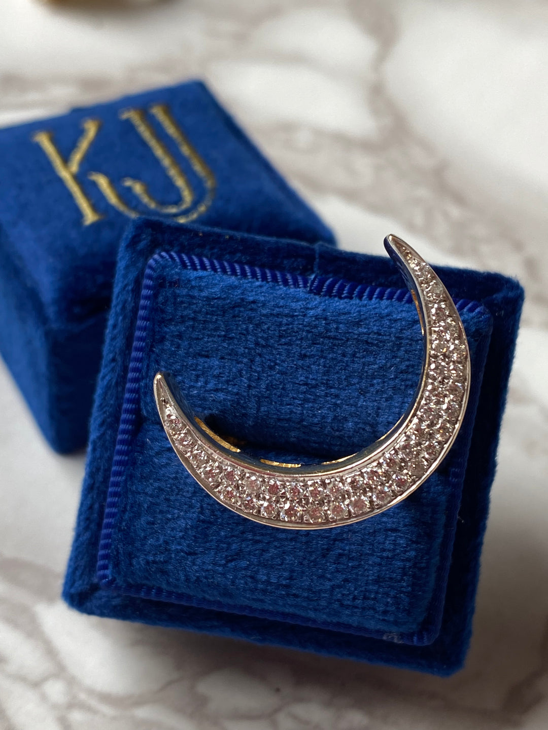 Diamond pave crescent moon cocktail ring in yellow gold 