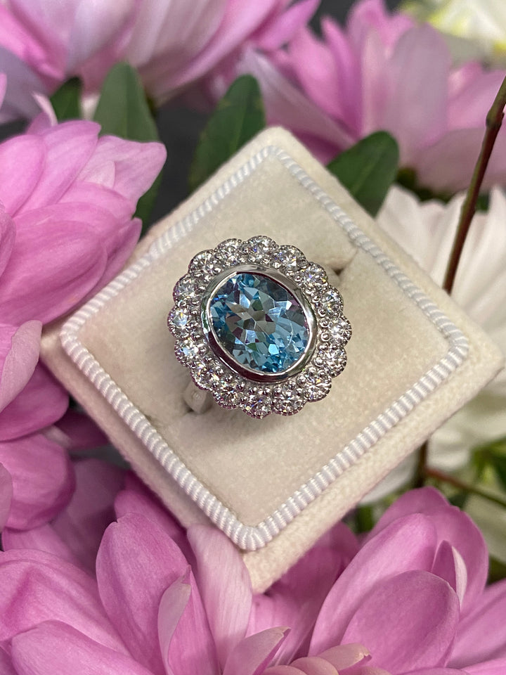 Blue Topaz and Moissanite Halo Cocktail Engagement Ring in Sterling Silver 