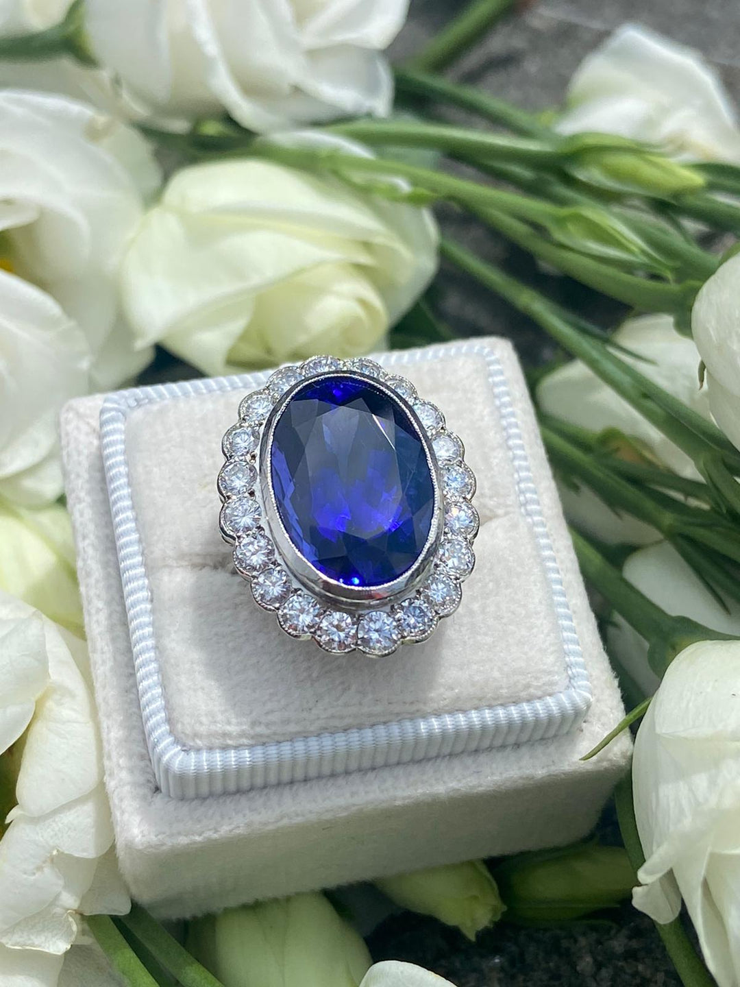 10 Carat Oval Tanzanite and Diamond Halo Cocktail Ring in Platinum