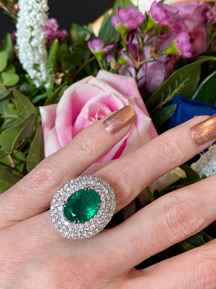 6.98 Carat Oval Cut Emerald and Diamond Triple Halo Ring in Platinum