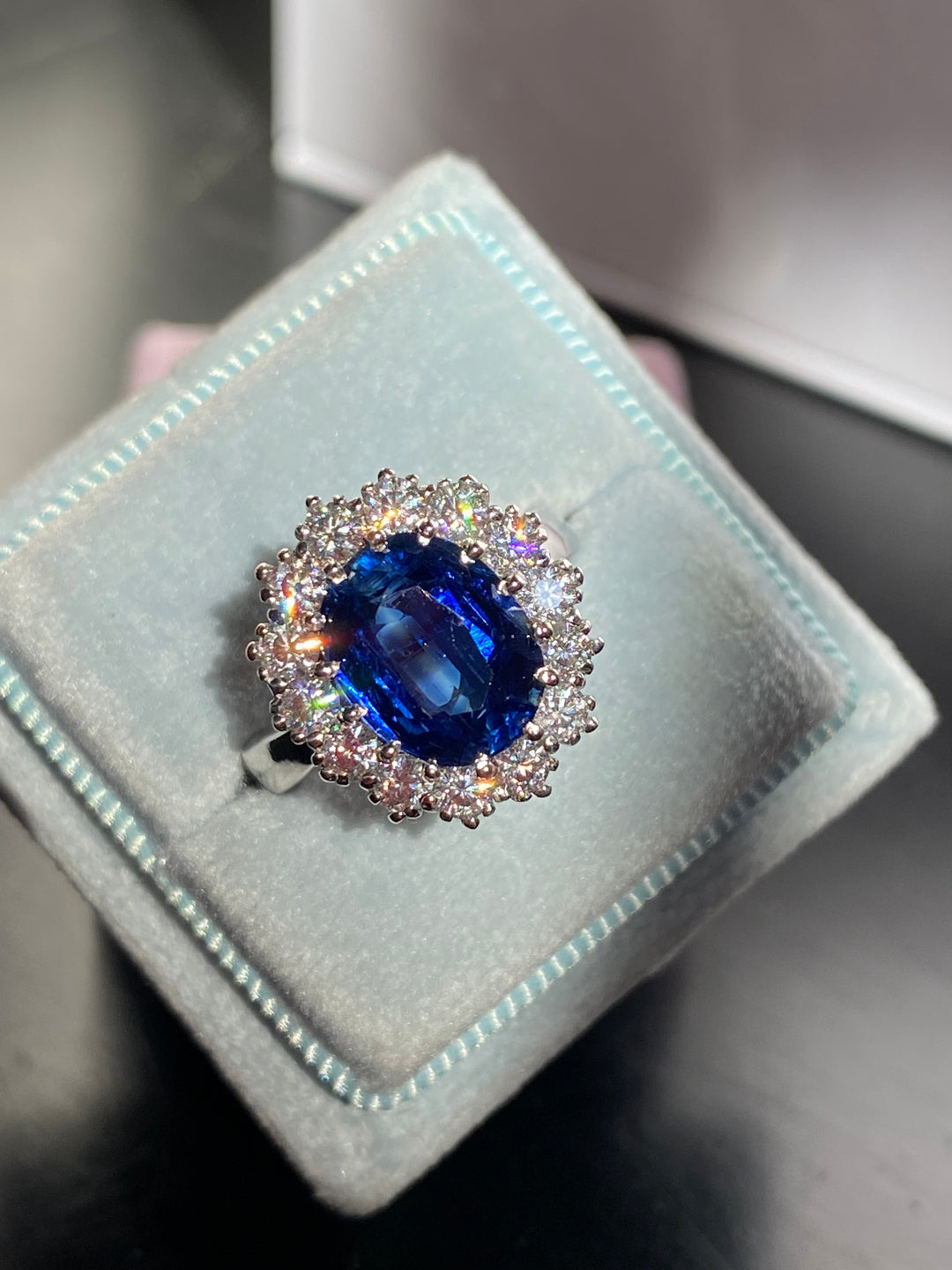 3.50 Carat Oval Blue Kyanite and Moissanite Halo Princess Diana Princess of Wales Kate Middleton Duchess of Cambridge Engagement Ring Katherine James Jewellery 