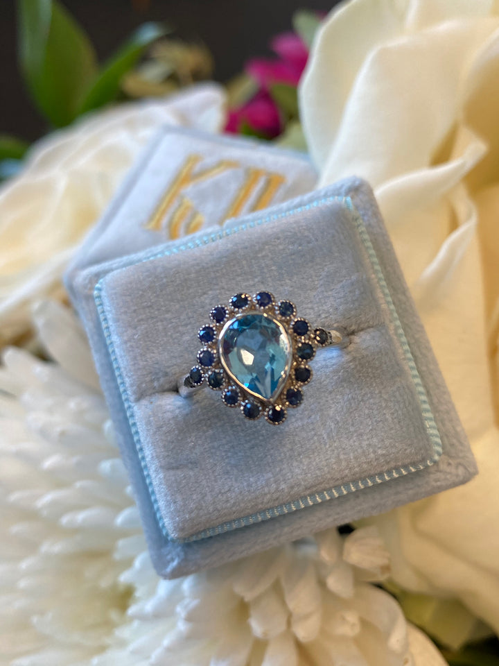 Pear Cut Blue Topaz and Blue Sapphire Halo Cocktail Ring in Sterling Silver 