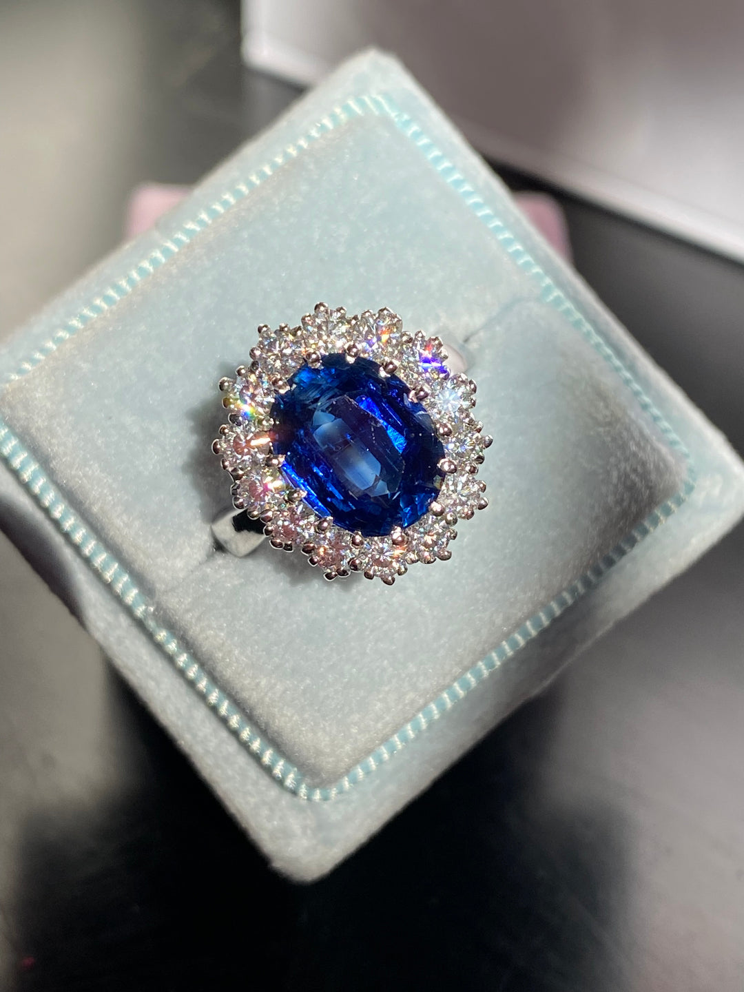 3.50 Carat Oval Blue Kyanite and Moissanite Halo Princess Diana Princess of Wales Kate Middleton Duchess of Cambridge Engagement Ring Katherine James Jewellery 