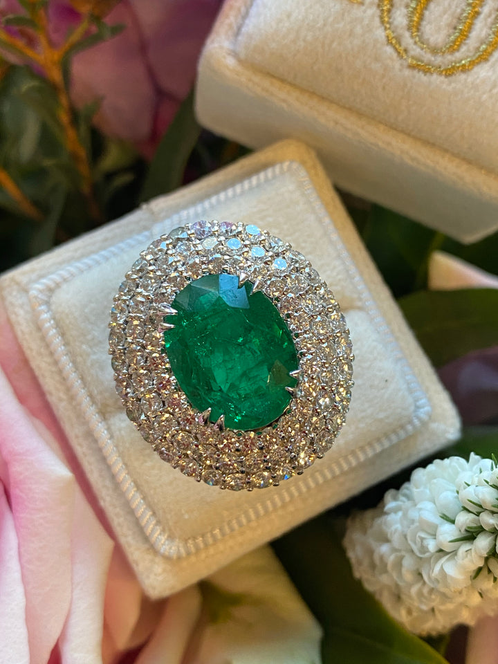 7 Carat Oval Cut Emerald and Triple Diamond Halo Engagement Cocktail Ring in Platinum 
