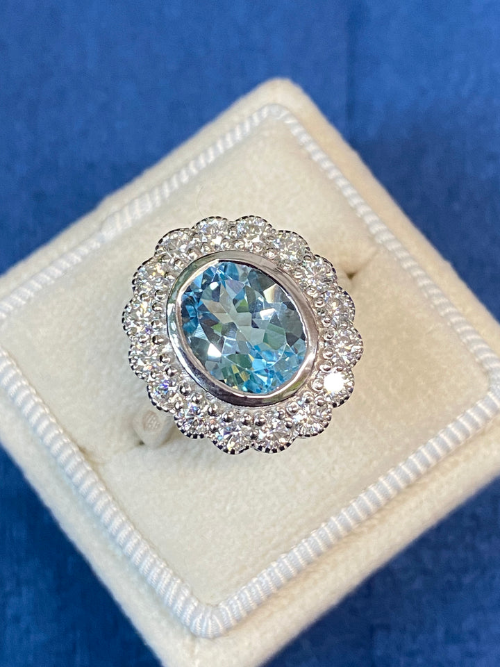 Blue Topaz and Moissanite Halo Cocktail Engagement Ring in Sterling Silver 