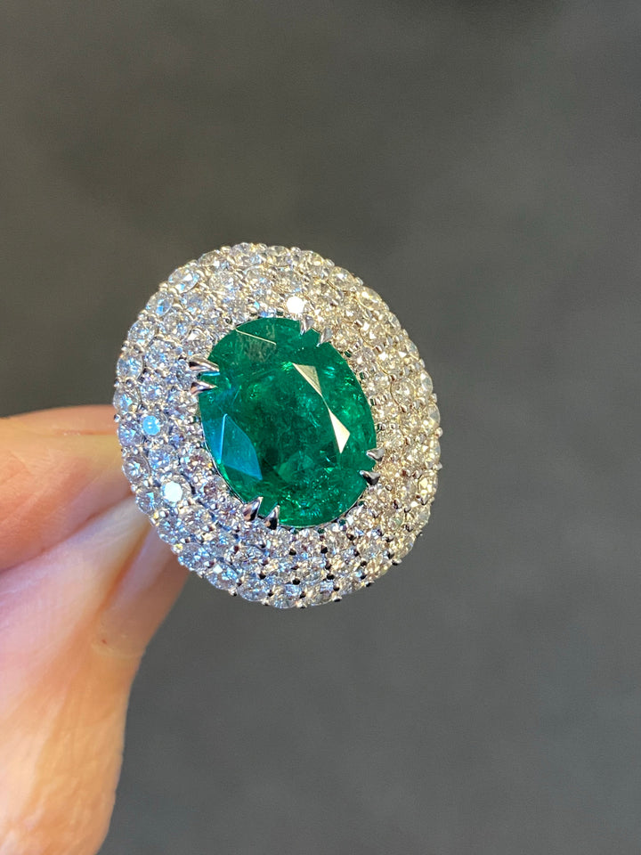 6.98 Carat Oval Cut Emerald and Diamond Triple Halo Ring in Platinum