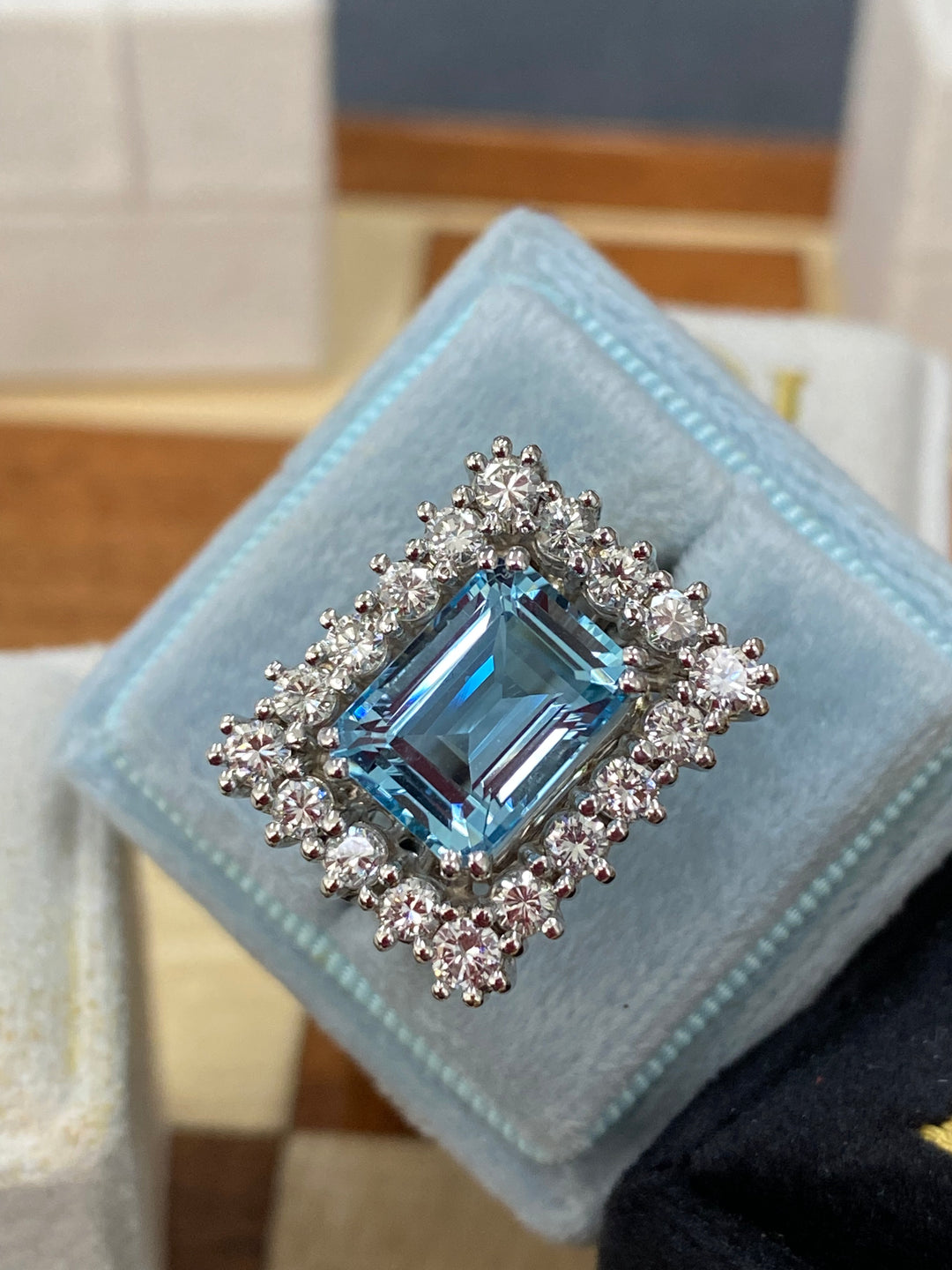 Emerald cut East West Aquamarine and Diamond Halo Cocktail Ring in Platinum 