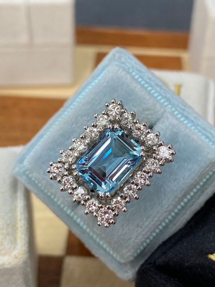 Emerald cut East West Aquamarine and Diamond Halo Cocktail Ring in Platinum 