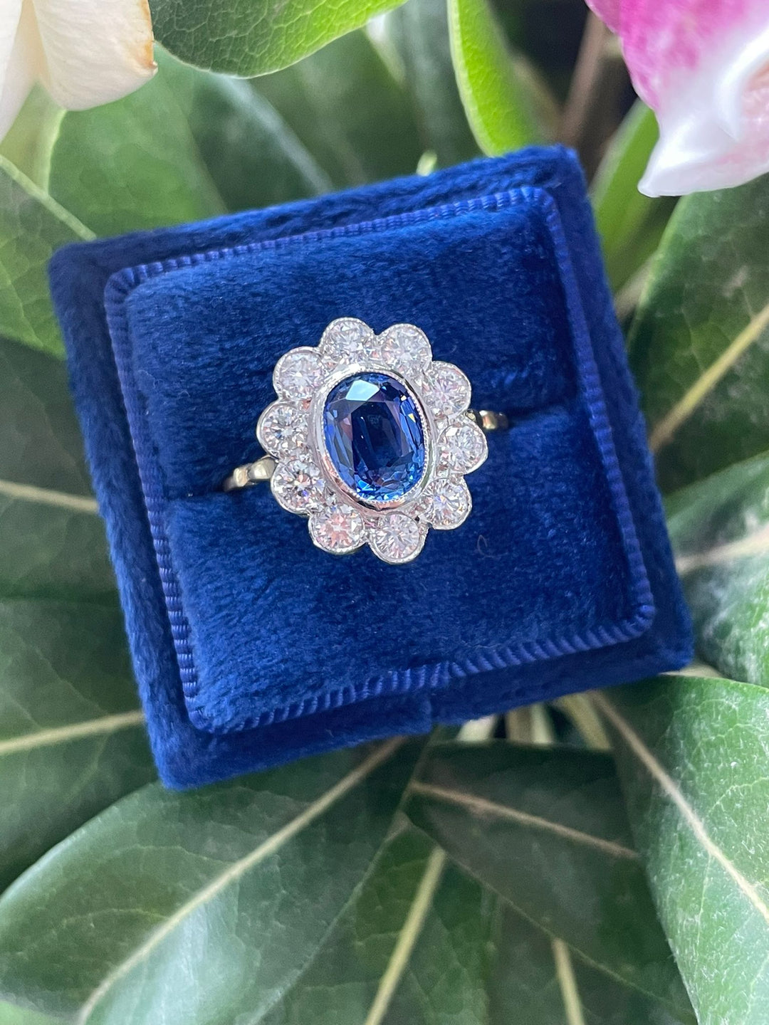 Oval cut Blue Ceylon Sapphire and Diamond Halo Antique Style Engagement Ring Katherine James Jewellery