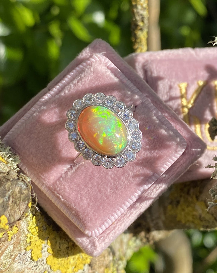 Oval Opal and Diamond Halo Engagement Ring 