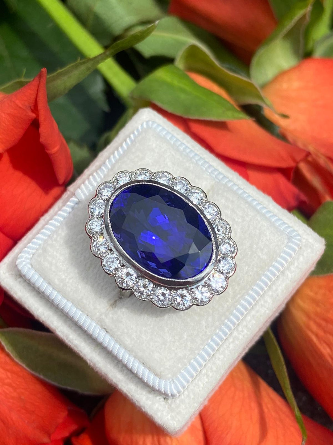 10 Carat Oval Tanzanite and Diamond Halo Cocktail Ring in Platinum