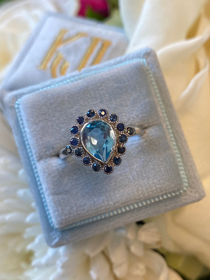 Pear Cut Blue Topaz and Blue Sapphire Halo Cocktail Ring in Sterling Silver 