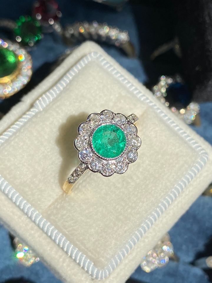 1.10 CTW Round Cut Emerald and Diamond Halo Engagement Ring in 18ct Gold