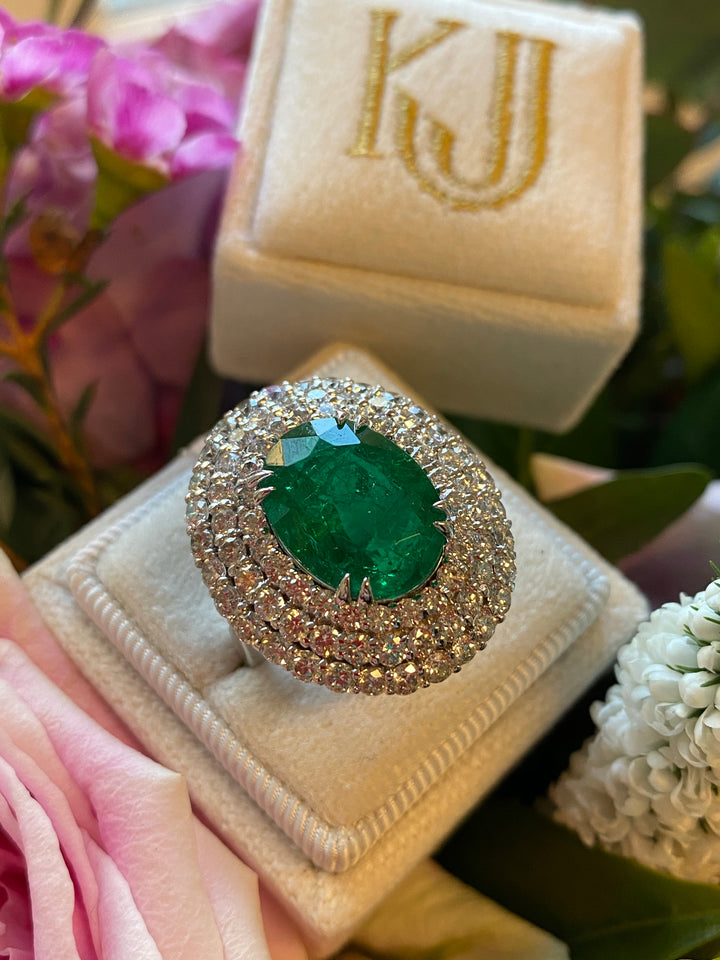 7 Carat Oval Cut Emerald and Triple Diamond Halo Engagement Cocktail Ring in Platinum 