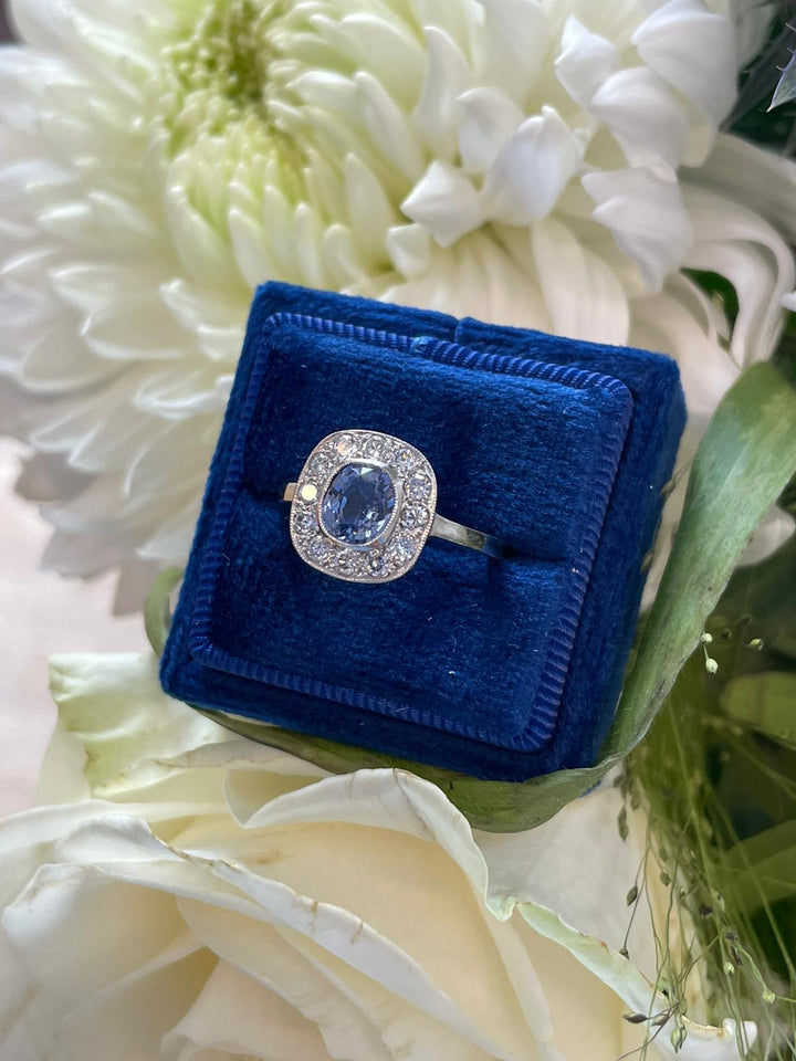 Cushion cut violet Blue Ceylon Sapphire and Diamond halo bezel engagement ring in Platinum