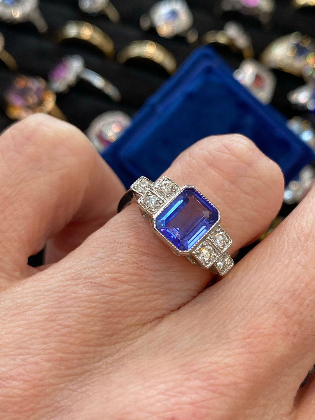 1.50 Carat emerald-cut Tanzanite and Diamond Art Deco Bezel Engagement Ring in Platinum