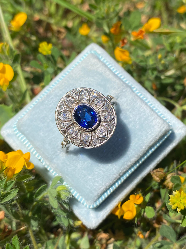 Antique Art Deco Oval Blue Sapphire and Diamond Halo Engagement Ring in Platinum 