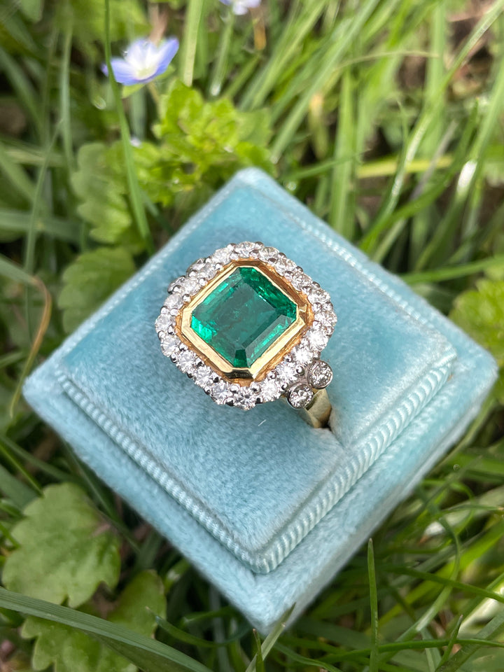 3 Carat Emerald and Diamond Halo Bezel Set Cocktail Engagement Ring in White and Yellow Gold 