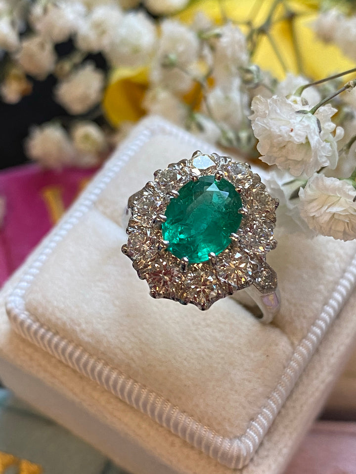 1.54 Carat Oval Cut Emerald and Diamond Halo Engagement Ring in Platinum 