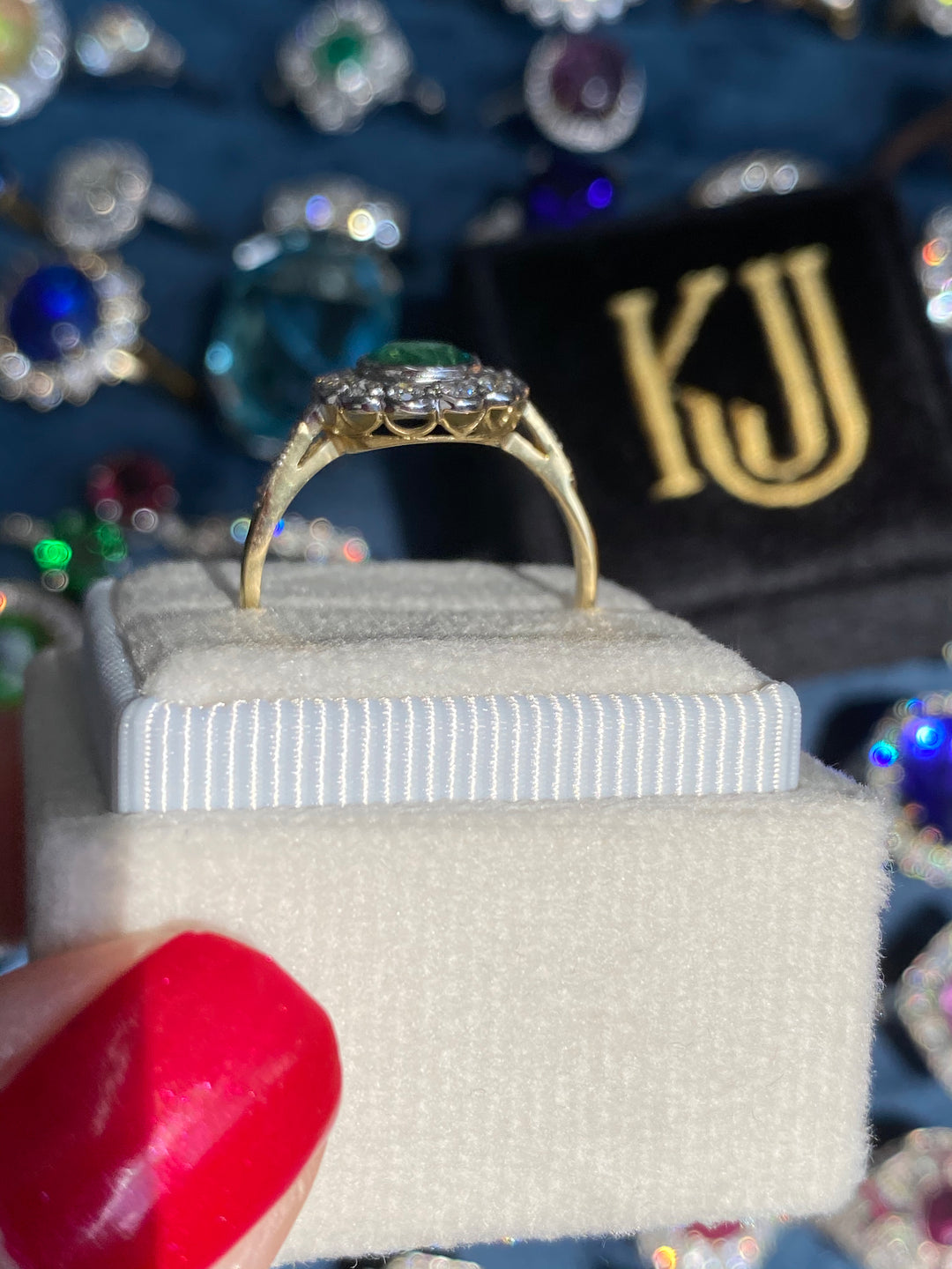 1.10 CTW Round Cut Emerald and Diamond Halo Engagement Ring in 18ct Gold